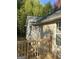 Tan colored siding house with a large backyard at 6995 Pine Shadow Way, Winston, GA 30187