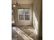 Sunlit dining area with large window and tile flooring at 6995 Pine Shadow Way, Winston, GA 30187