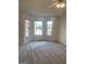 Main bedroom with bay window and carpeted floors at 6995 Pine Shadow Way, Winston, GA 30187