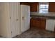 White appliances and wood cabinets highlight this kitchen at 6995 Pine Shadow Way, Winston, GA 30187