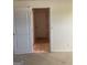 Short hallway with doors leading to different rooms at 6995 Pine Shadow Way, Winston, GA 30187