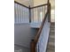 Wooden and white railings staircase leading to the second floor at 6995 Pine Shadow Way, Winston, GA 30187