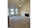 Living room with fireplace and ceiling fan at 6995 Pine Shadow Way, Winston, GA 30187