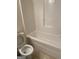 Simple bathroom with a toilet and bathtub at 6995 Pine Shadow Way, Winston, GA 30187