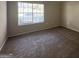 Bright bedroom featuring neutral carpeting and a large window at 2755 Knollberry Ln, Decatur, GA 30034