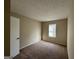 Spacious bedroom with neutral carpeting and large window at 2755 Knollberry Ln, Decatur, GA 30034