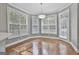 Bright breakfast room with hardwood floors and large windows at 684 Brooks Woolsey Rd, Brooks, GA 30205