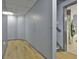 Unfinished basement with light wood flooring and gray walls at 684 Brooks Woolsey Rd, Brooks, GA 30205