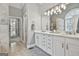 Elegant bathroom with double vanity, large mirror, and walk-in shower at 684 Brooks Woolsey Rd, Brooks, GA 30205