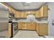 Efficient basement kitchen featuring stainless steel appliances and wood cabinets at 684 Brooks Woolsey Rd, Brooks, GA 30205
