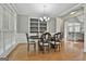 Bright dining room with built-in shelving, hardwood floors, and a chandelier at 684 Brooks Woolsey Rd, Brooks, GA 30205