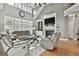 Open living room with high ceilings, fireplace, and large windows at 684 Brooks Woolsey Rd, Brooks, GA 30205