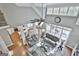 Open living room with high ceilings, hardwood floors, and view of kitchen at 684 Brooks Woolsey Rd, Brooks, GA 30205