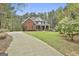 Two-story brick home with a nicely landscaped yard at 684 Brooks Woolsey Rd, Brooks, GA 30205
