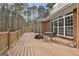 Deck overlooks private wooded backyard with seating area at 684 Brooks Woolsey Rd, Brooks, GA 30205