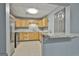 Basement kitchen with light wood cabinets and stainless steel appliances at 684 Brooks Woolsey Rd, Brooks, GA 30205