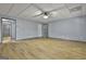 Finished basement recreation room with light blue walls and wood-look flooring at 684 Brooks Woolsey Rd, Brooks, GA 30205