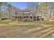 Two story brick home with deck, shed, and yard at 684 Brooks Woolsey Rd, Brooks, GA 30205