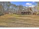 Spacious backyard with large deck, shed, and wooded area at 684 Brooks Woolsey Rd, Brooks, GA 30205