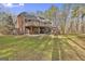 Brick house with large deck and backyard access at 684 Brooks Woolsey Rd, Brooks, GA 30205