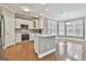 Modern kitchen with white cabinets, stainless steel appliances, and an island at 684 Brooks Woolsey Rd, Brooks, GA 30205