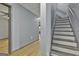 Basement with stairs, light wood flooring and gray walls at 684 Brooks Woolsey Rd, Brooks, GA 30205