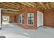 Unfinished basement with garage access and large window at 684 Brooks Woolsey Rd, Brooks, GA 30205