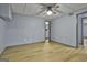 Spacious finished basement bedroom with light blue walls and wood-look flooring at 684 Brooks Woolsey Rd, Brooks, GA 30205
