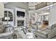 Relaxing living room with hardwood floors, a fireplace, and built-in shelving at 684 Brooks Woolsey Rd, Brooks, GA 30205