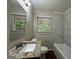 Clean bathroom with updated fixtures and a granite vanity at 2425 Hanford Sw Dr, Atlanta, GA 30315