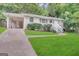 Ranch home with attached carport and landscaped yard at 2425 Hanford Sw Dr, Atlanta, GA 30315