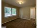 Bright bedroom with carpet flooring and ample natural light at 2425 Hanford Sw Dr, Atlanta, GA 30315