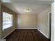Living room with wood-look floors and neutral walls at 2425 Hanford Sw Dr, Atlanta, GA 30315