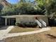 Ranch home with attached carport, landscaped yard, and red door at 2425 Hanford Sw Dr, Atlanta, GA 30315