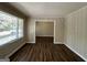 Bright living room with wood-look floors and window at 2425 Hanford Sw Dr, Atlanta, GA 30315
