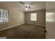 Well-lit bedroom featuring a ceiling fan and plush carpeting at 2425 Hanford Sw Dr, Atlanta, GA 30315