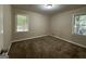 Spacious bedroom with neutral carpeting and large windows at 2425 Hanford Sw Dr, Atlanta, GA 30315