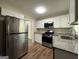 Modern kitchen with stainless steel appliances at 1154 Penn Ct, Atlanta, GA 30315