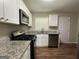 Modern kitchen with white cabinets at 1154 Penn Ct, Atlanta, GA 30315