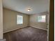 Bright bedroom with neutral walls, carpet flooring, and window blinds at 1154 Penn Ct, Atlanta, GA 30315