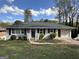 Charming ranch home with a neatly landscaped lawn at 2150 Macon Se Dr, Atlanta, GA 30315