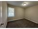 Bright bedroom featuring neutral walls and carpeting at 2150 Macon Se Dr, Atlanta, GA 30315