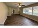 Open concept living room with view into kitchen and hardwood floors at 2150 Macon Se Dr, Atlanta, GA 30315
