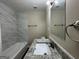 Bathroom with marble tile, granite countertop, and bathtub at 2150 Macon Se Dr, Atlanta, GA 30315