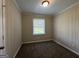 Bedroom with neutral walls, carpet, and window at 2150 Macon Se Dr, Atlanta, GA 30315
