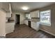 Modern kitchen with white cabinets, granite counters and stainless steel appliances at 2150 Macon Se Dr, Atlanta, GA 30315