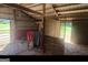Barn stall with wood flooring and tack area at 7866 Hwy 54, Sharpsburg, GA 30277