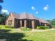 Ranch style brick home with landscaping at 7866 Hwy 54, Sharpsburg, GA 30277