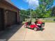 Brick garage with golf cart and ample parking at 7866 Hwy 54, Sharpsburg, GA 30277