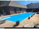 Inviting rectangular pool with diving board, surrounded by planters at 7866 Hwy 54, Sharpsburg, GA 30277